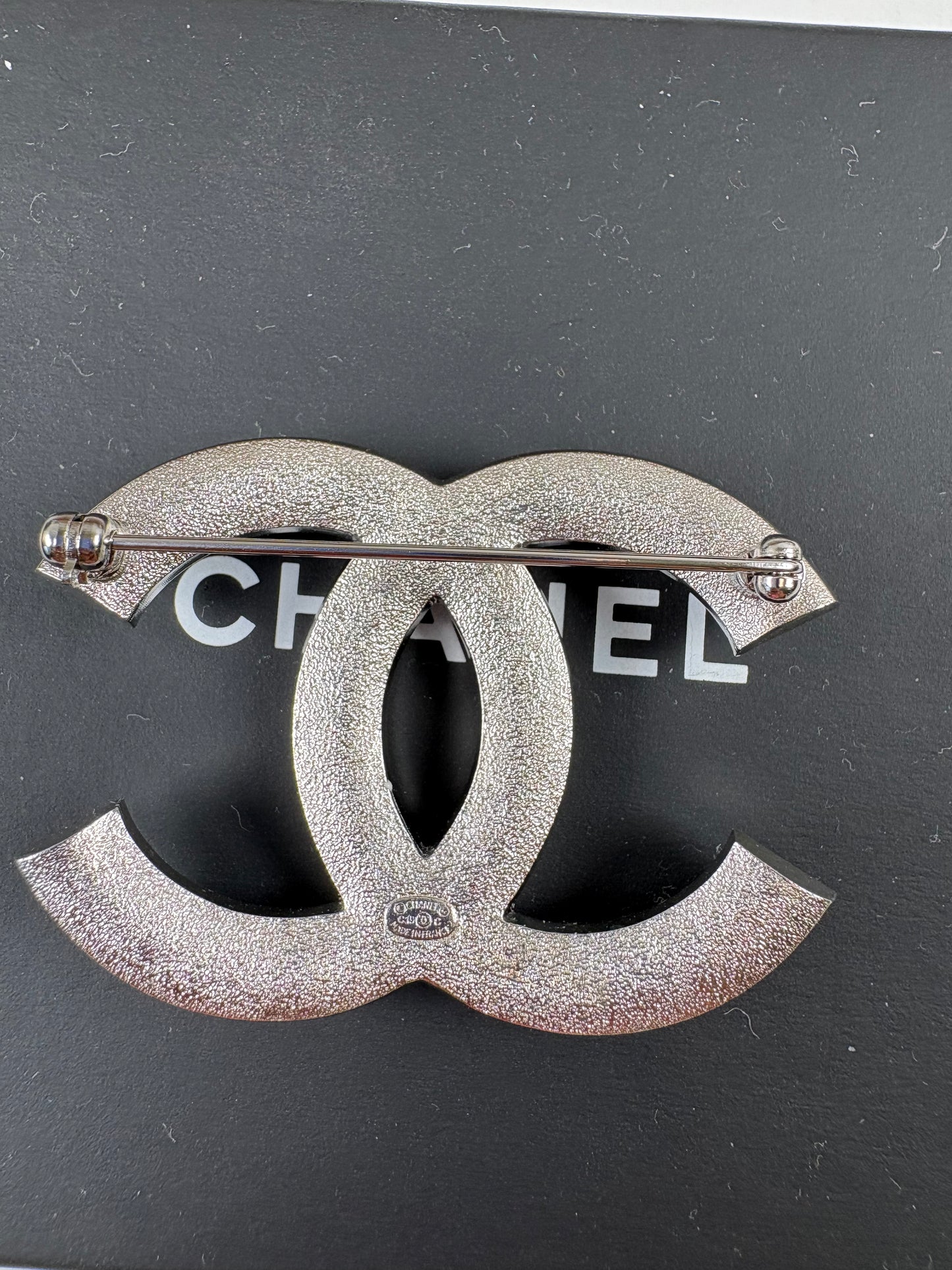Pre-Owned CHANEL™ Silver Tone Interlocking CC Logo Brooch, Silver
